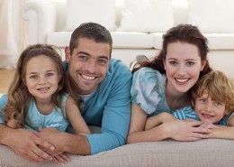 Family On Floor In Living-room