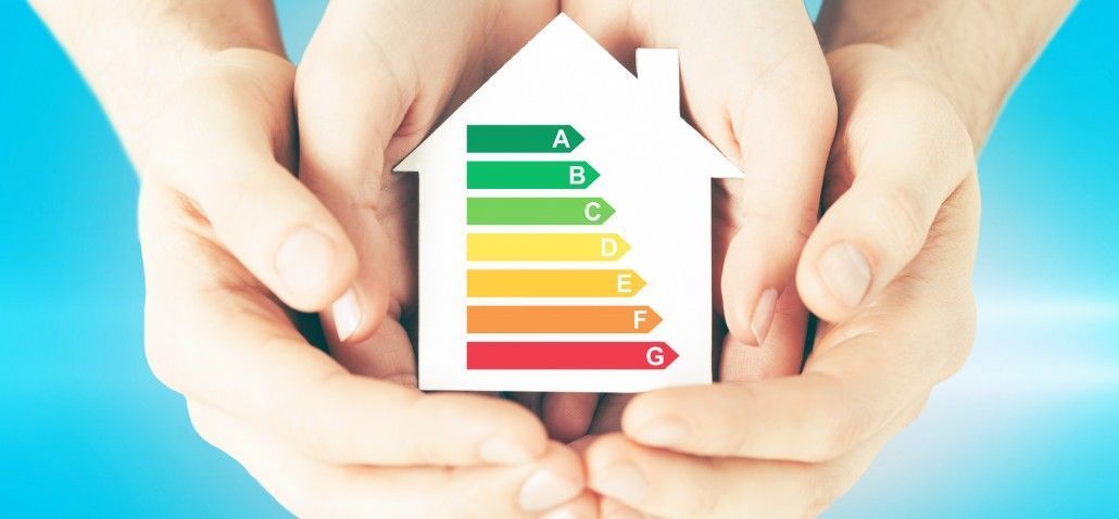 energy saving, real estate and family home concept - closeup of