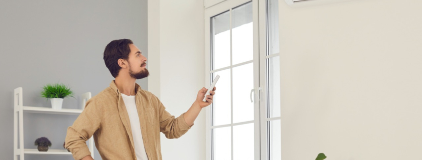 Una persona fent ús de l'aire condicionat a l'hivern